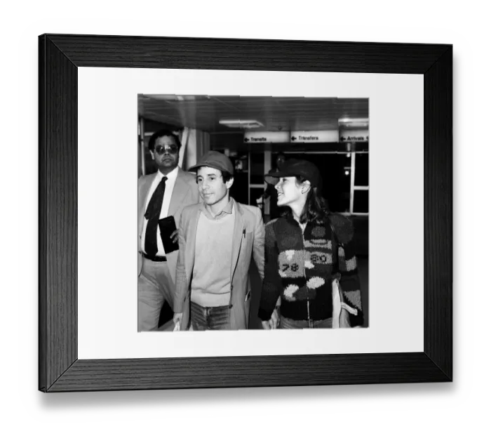 Framed Print : American musician Paul Simon and actress Carrie Fisher at Heathrow airport. 24th May 1980 Framed Print : American musician Paul Simon and actress Carrie Fisher at Heathrow airport. 24th May 1980