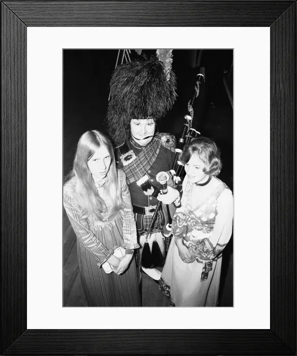 Framed Print : Two ball goers pose with the piper at the Birmingham and West Midlands Scottish Society Framed Print : Two ball goers pose with the piper at the Birmingham and West Midlands Scottish Society