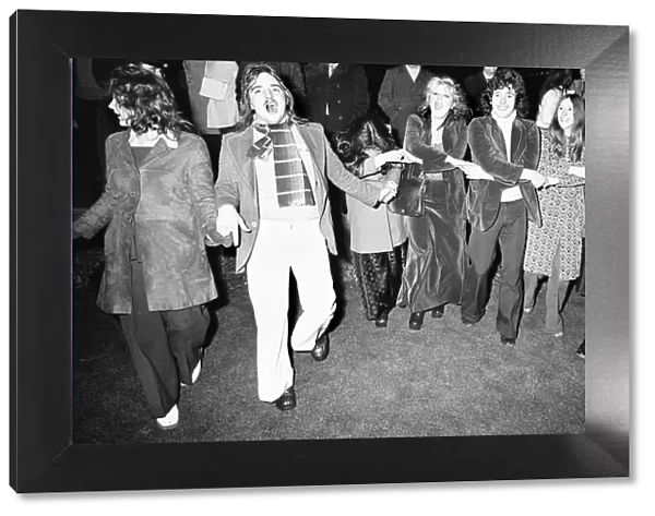 New Year Revellers seeing in 1973 in Centenary Square Birmingham sing Auld Lang Syne