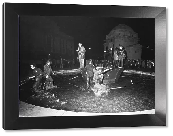 New Year Revellers seeing in 1973 by taking a quick dip in the fountain in Centenary
