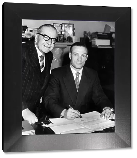 Charlie Mitten signs the agreement to become the new manager of Newcastle United watched
