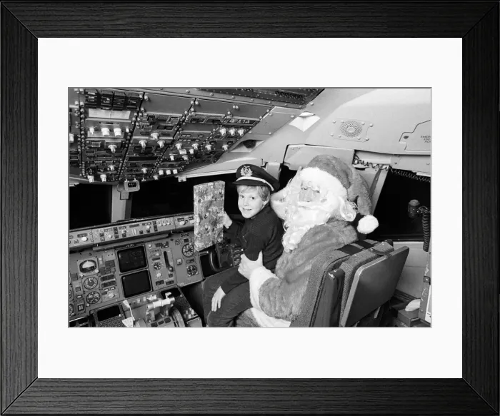 Framed Print : Examiner Womens Circle special Christmas Flight - Santa in the Boeing 757 flying