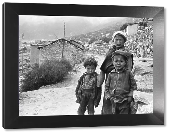 Sherpa children pose in the street of one of the high villages in the SoluKhumbu region