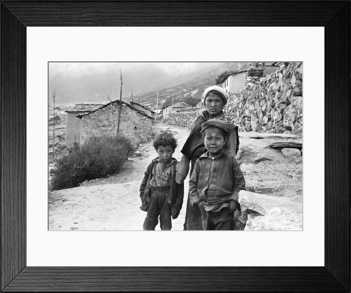 Framed Print : Sherpa children pose in the street of one of the high villages in the SoluKhumbu region Framed Print : Sherpa children pose in the street of one of the high villages in the SoluKhumbu region