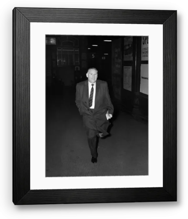 Framed Print : Tottenham Hotspur manager Bill Nicholson hurries out of Preston Station as he tries to Framed Print : Tottenham Hotspur manager Bill Nicholson hurries out of Preston Station as he tries to