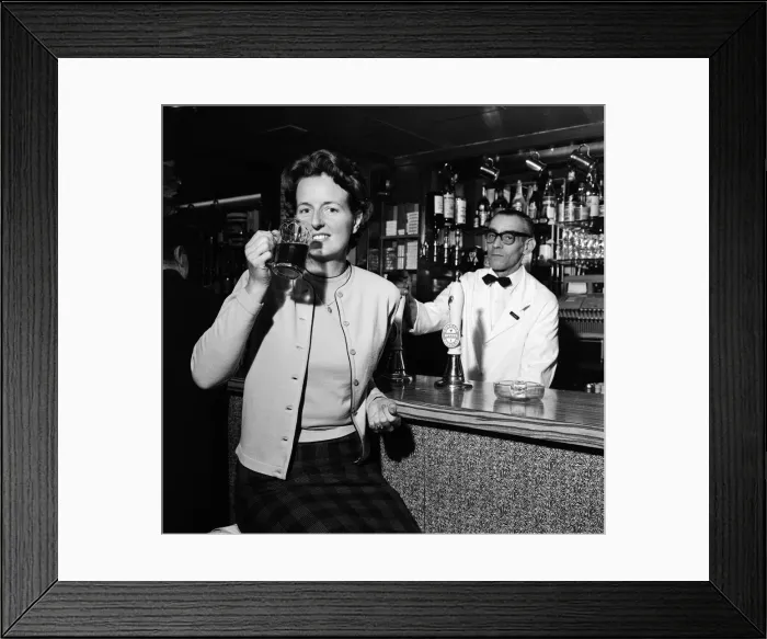 Framed Print : Daily Mirror photographer Doreen Spooner drinking beer for a feature in the Daily Mirror Framed Print : Daily Mirror photographer Doreen Spooner drinking beer for a feature in the Daily Mirror