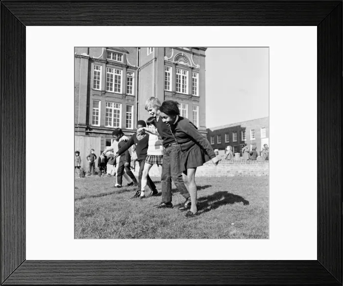 Framed Print : Children playing at Penton Junior School, Islington, North London, 11th March 1971