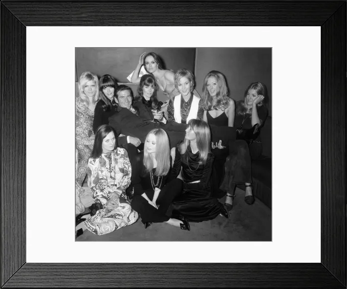 Framed Print : Rod Taylor with some of the girls who will appear in his new film Framed Print : Rod Taylor with some of the girls who will appear in his new film
