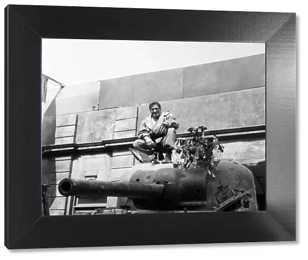 Rod Taylor, on a Sherman tank, on the set of MGMs new film The Liquidator