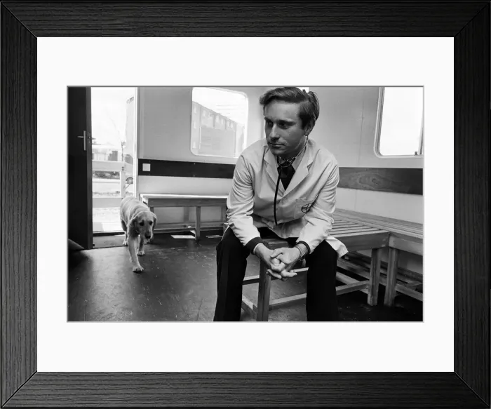 Framed Print : Its a dog life for this Birmingham vet. He is stationed in a mobile hut on land in