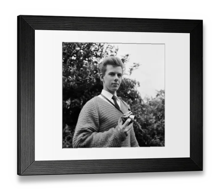 Framed Print : 23 year old Gordon Faulkner in his garden, holding the camera with which he photographed Framed Print : 23 year old Gordon Faulkner in his garden, holding the camera with which he photographed