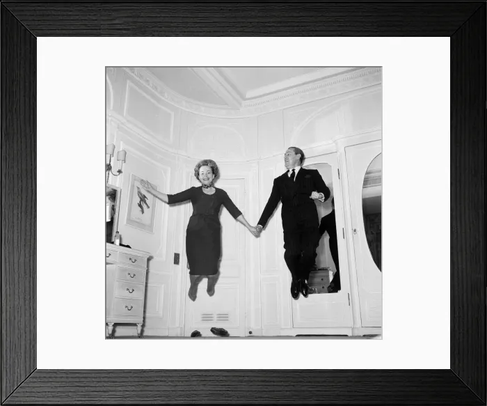 Framed Print : Olivia De Havilland playing a jumping game with her husband Pierre Galante Framed Print : Olivia De Havilland playing a jumping game with her husband Pierre Galante