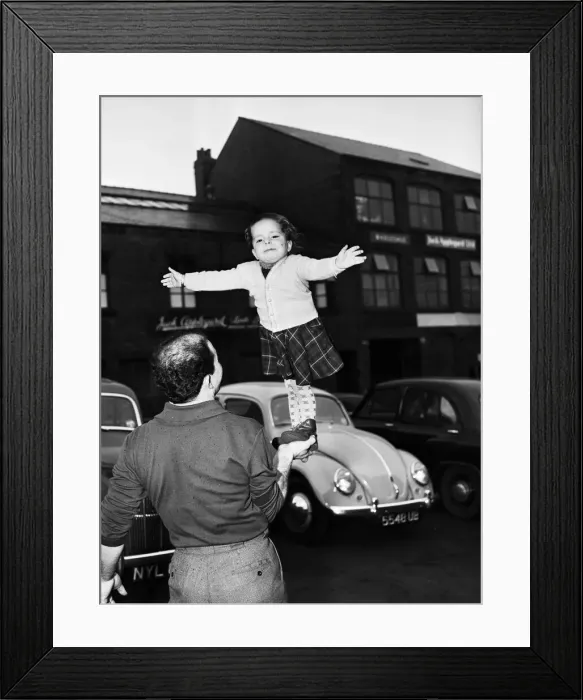Framed Print : 2 year old Sumisha Hassani, daughter of Ali Hassani, the leader of a troupe of whirlwind