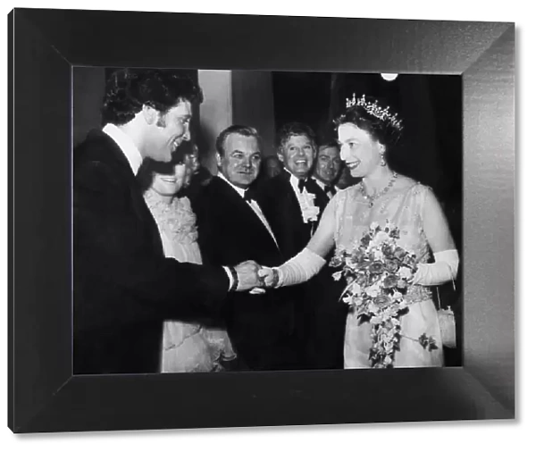 The Queen shaking hands with Tom Jones at the Royal Variety Show at the London Palladium