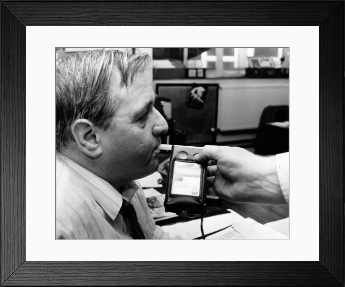 Framed Print : Stuart Minton, News Editor, South Wales Echo Newspaper, tries out a breathalyser test Framed Print : Stuart Minton, News Editor, South Wales Echo Newspaper, tries out a breathalyser test