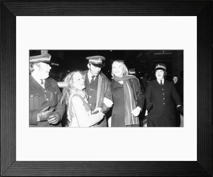 Framed Print : Police share a joke and a kiss with New Year revellers in Broadgate 31st December 1971 Framed Print : Police share a joke and a kiss with New Year revellers in Broadgate 31st December 1971