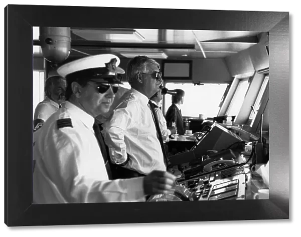 Captain Robin Woodall, Master of the QE2, on the bridge of the ship as it is sailed into