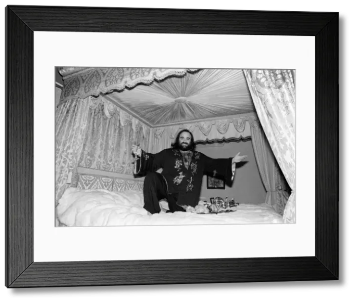 Framed Print : Demis Roussos November 1977 Perched on his mink covered bed which cost 30 Framed Print : Demis Roussos November 1977 Perched on his mink covered bed which cost 30