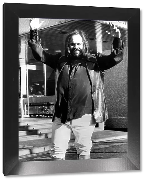 Greek singer Demis Roussos wearing platform boots before his concert at Newcastle City