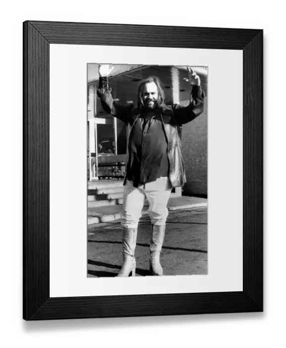 Framed Print : Greek singer Demis Roussos wearing platform boots before his concert at Newcastle City