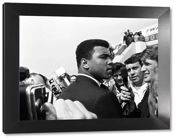 Cassius Clay Muhammad Ali) arrives in England ahead of his rematch with Henry Cooper