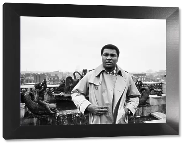 Muhammad Ali, former heavyweight boxing champion, stepping outside into the rain after a