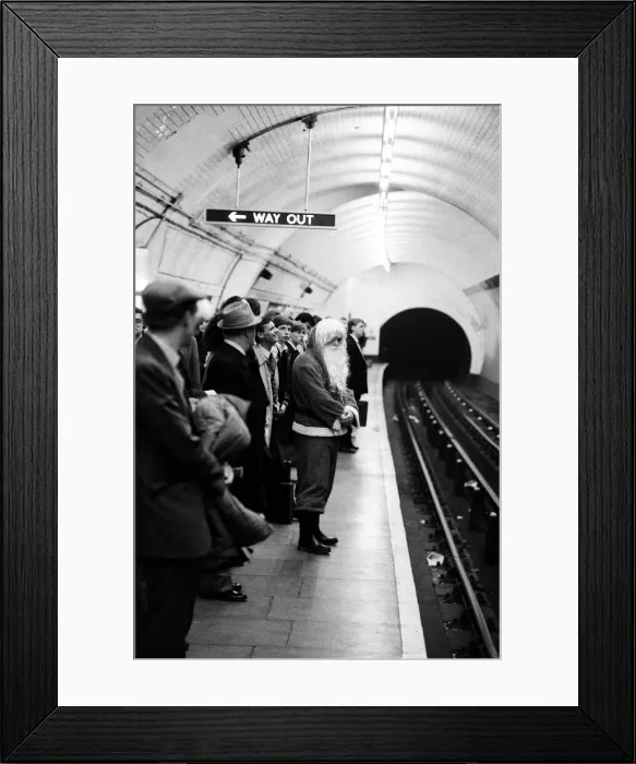Framed Print : Father Christmas, of Bentalls Store, Ealing, takes the tube to pick up his sleigh Framed Print : Father Christmas, of Bentalls Store, Ealing, takes the tube to pick up his sleigh
