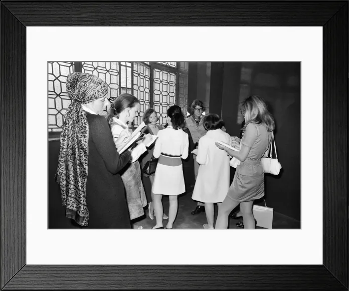 Framed Print : Yves Saint Laurent, designer, pictured speaking with journalists at the opening of his