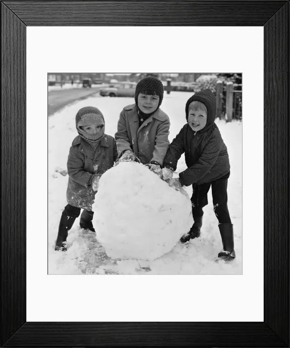 Framed Print : Do you want to build a snowman? Three children seen here in Reading take advantage of Framed Print : Do you want to build a snowman? Three children seen here in Reading take advantage of