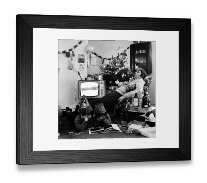 Framed Print : A typical family scene around the television on Christmas day Framed Print : A typical family scene around the television on Christmas day