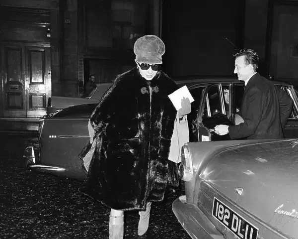 Barbra Streisand, exits car to make her way to stage door entrance at Prince of Wales