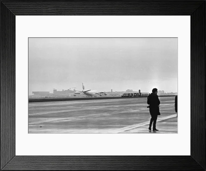 Framed Print : Photographer on the apron following the arrival of the first Boeing 747