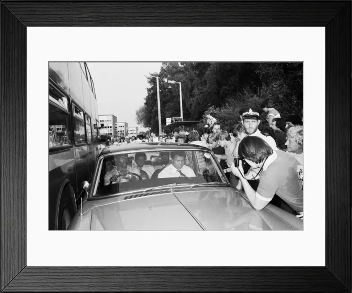 Framed Print : Muhammad Ali in the passenger seat makes his way through Coventry mobbed by fans