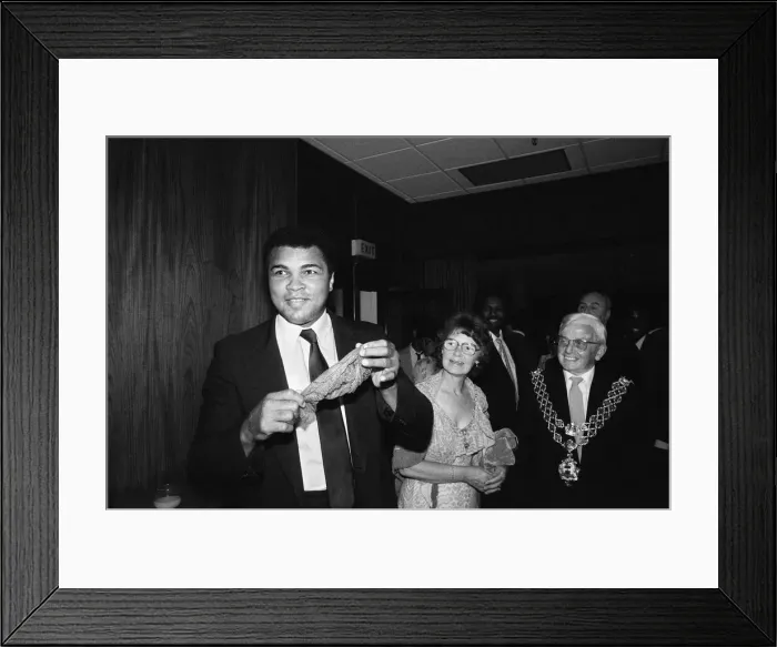 Framed Print : Muhammad Ali (left) shows off a conjuring trick when visiting Birmingham Framed Print : Muhammad Ali (left) shows off a conjuring trick when visiting Birmingham