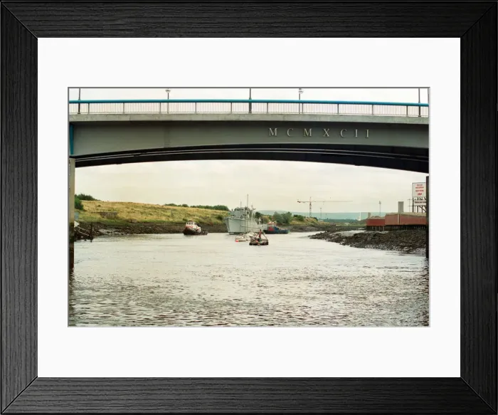 Framed Print : Former Navy Minehunter HMS Kellington being towed underneath the Princess of Wales Bridge