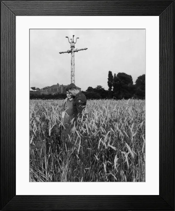 Framed Print : An American soldier and his girlfriend take a stroll through a field of barley near Framed Print : An American soldier and his girlfriend take a stroll through a field of barley near
