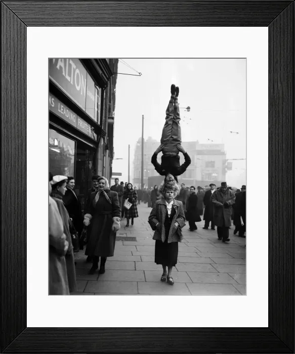 Framed Print : Two girls from the Chaludis act perform in the street at Hammersmith, London Framed Print : Two girls from the Chaludis act perform in the street at Hammersmith, London