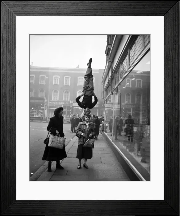 Framed Print : Two girls from the Chaludis act perform in the street at Hammersmith, London Framed Print : Two girls from the Chaludis act perform in the street at Hammersmith, London