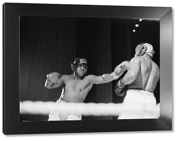 Muhammad Ali having fun with a spectator at boxing exhibition match in Birmingham