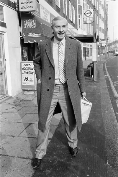 Harvey Proctor, MP for Billericay, Essex, pictured standing outside a newsagent