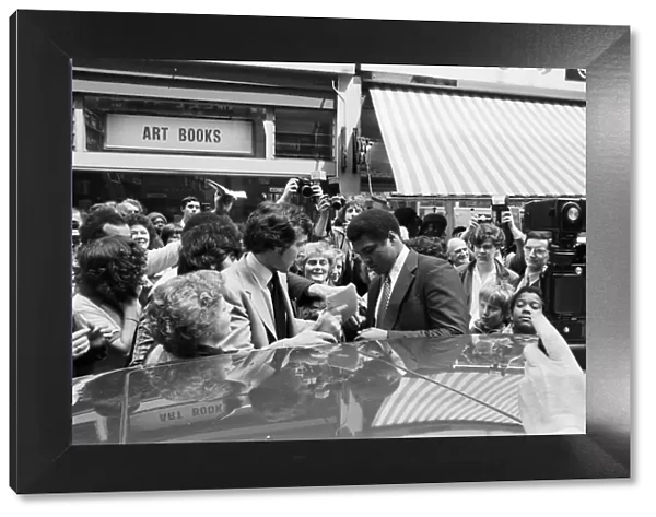 Muhammad Ali signing autographs outside the Odeon in Birmingham. 7th June 1979