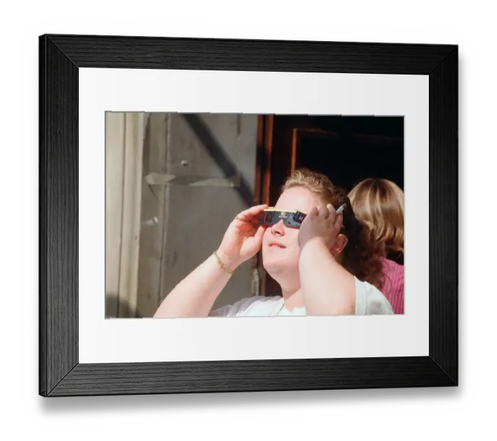 Framed Print : People watching a total solar eclipse, Queen Street, Cardiff. 11th August 1999 Framed Print : People watching a total solar eclipse, Queen Street, Cardiff. 11th August 1999