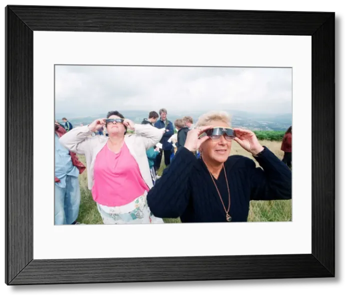 Framed Print : People watching a total solar eclipse, Caerphilly mountain. 11th August 1999 Framed Print : People watching a total solar eclipse, Caerphilly mountain. 11th August 1999