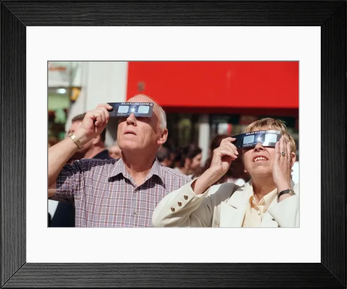 Framed Print : People watching a total solar eclipse, Queen Street, Cardiff. 11th August 1999 Framed Print : People watching a total solar eclipse, Queen Street, Cardiff. 11th August 1999