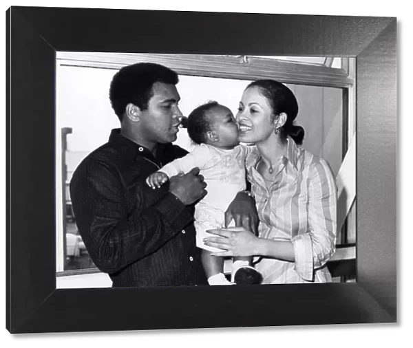 Boxer Mohammad Ali with his wife Veronica and 1 year old baby Hanna leaving Heathrow