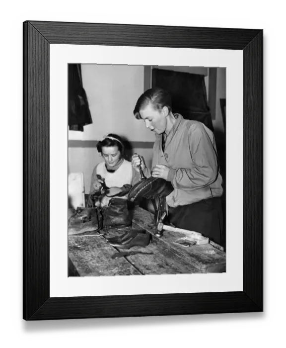 Framed Print : Lincoln Camp School. One of the females staff of the Lincoln Camp School repairing her