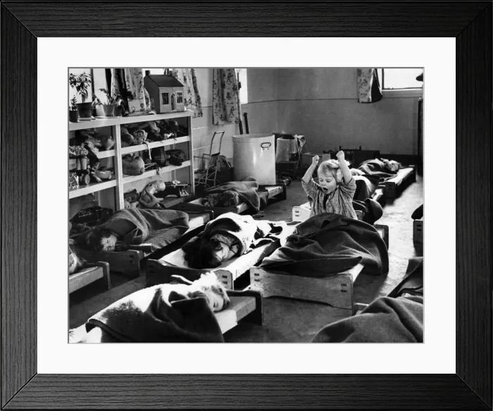 Framed Print : At the new wartime day nursery at Cadoxton Glamorgan, Little Marilyn Fox stretches Framed Print : At the new wartime day nursery at Cadoxton Glamorgan, Little Marilyn Fox stretches