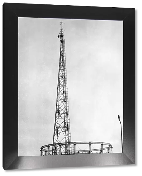 Men balance precariously 100ft up the radio mast at Gaythorn Gas Works