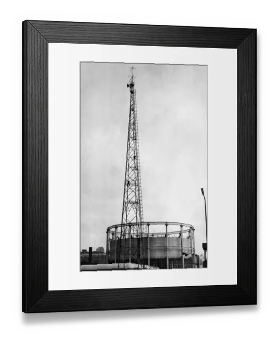 Framed Print : Men balance precariously 100ft up the radio mast at Gaythorn Gas Works Framed Print : Men balance precariously 100ft up the radio mast at Gaythorn Gas Works