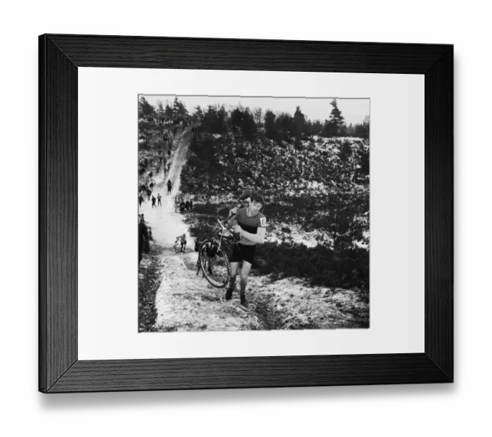 Framed Print : Bagshot Cyclist carries his bike during the Competition on Bagshot Heath Surrey Framed Print : Bagshot Cyclist carries his bike during the Competition on Bagshot Heath Surrey